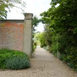 Mauerdurchgang zum nächsten Bereich, Walled Garden Holkam Hall, Norfolk
